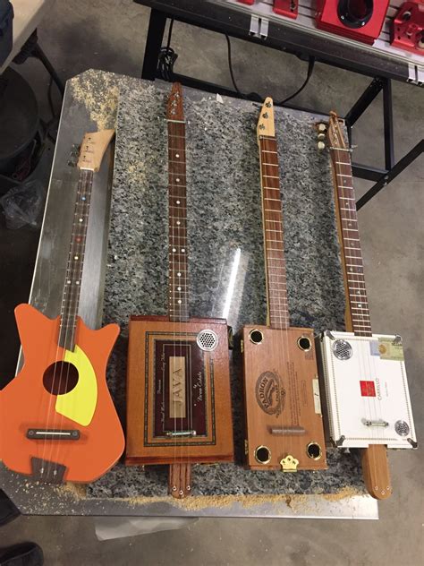 how to make a cigar box guitar louder without electrics|cigar box guitar video.